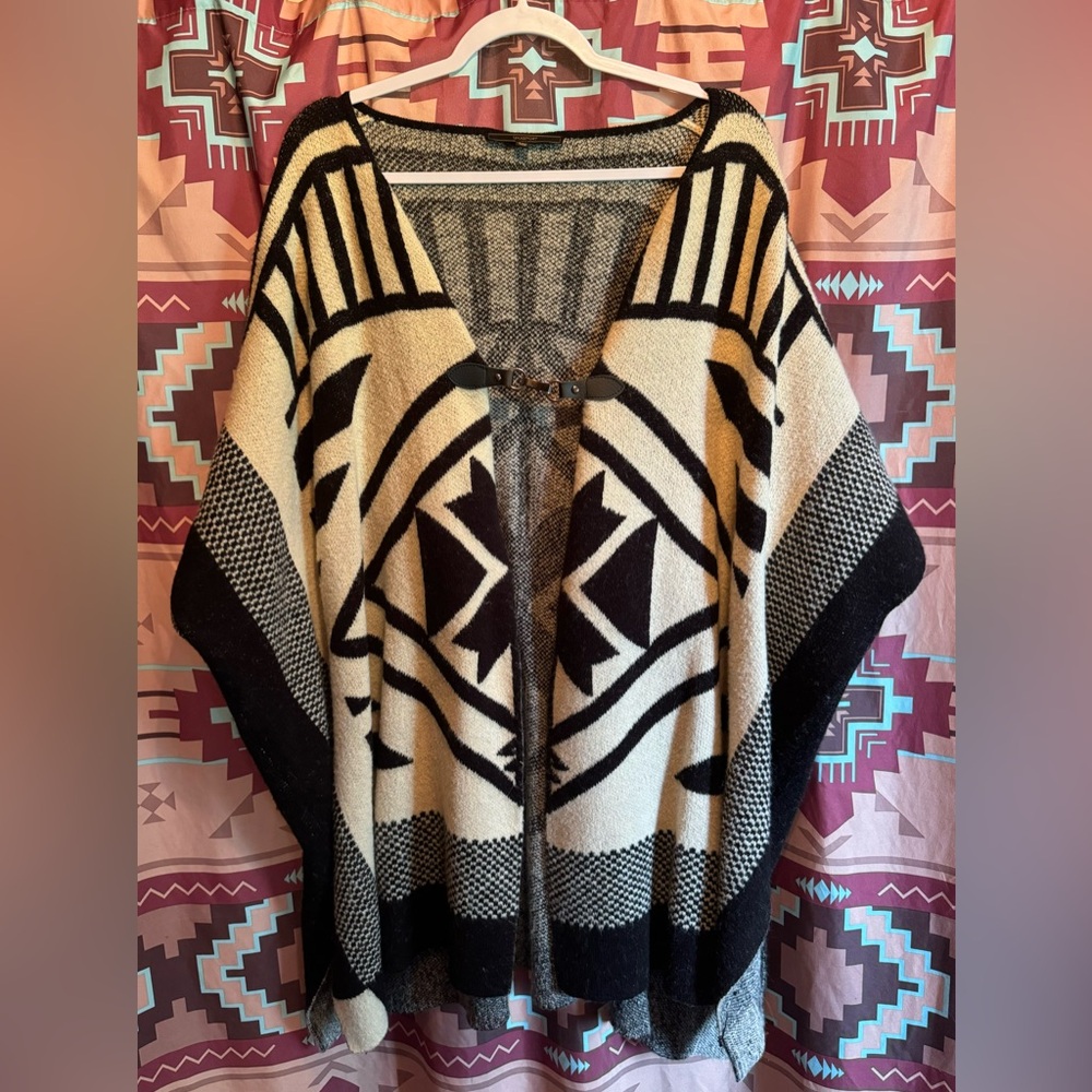“Maxsport” small/medium, black & cream colored women’s poncho.